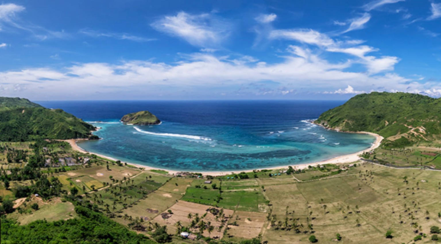 Wide aerial view across Are Guling Bay and the South Lombok coastline